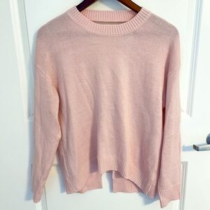 Revolve About Us pink open back sweater